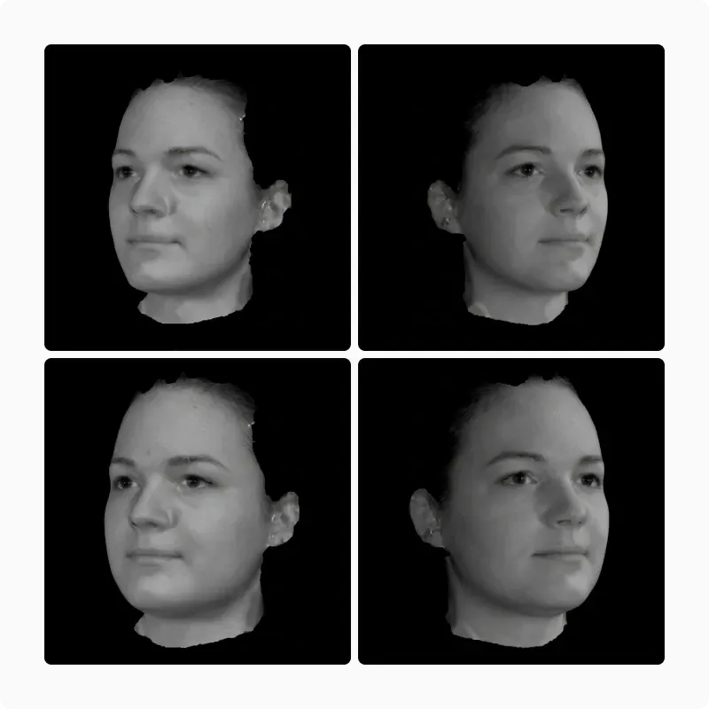 Four grayscale 3D facial scans of a young woman from different angles