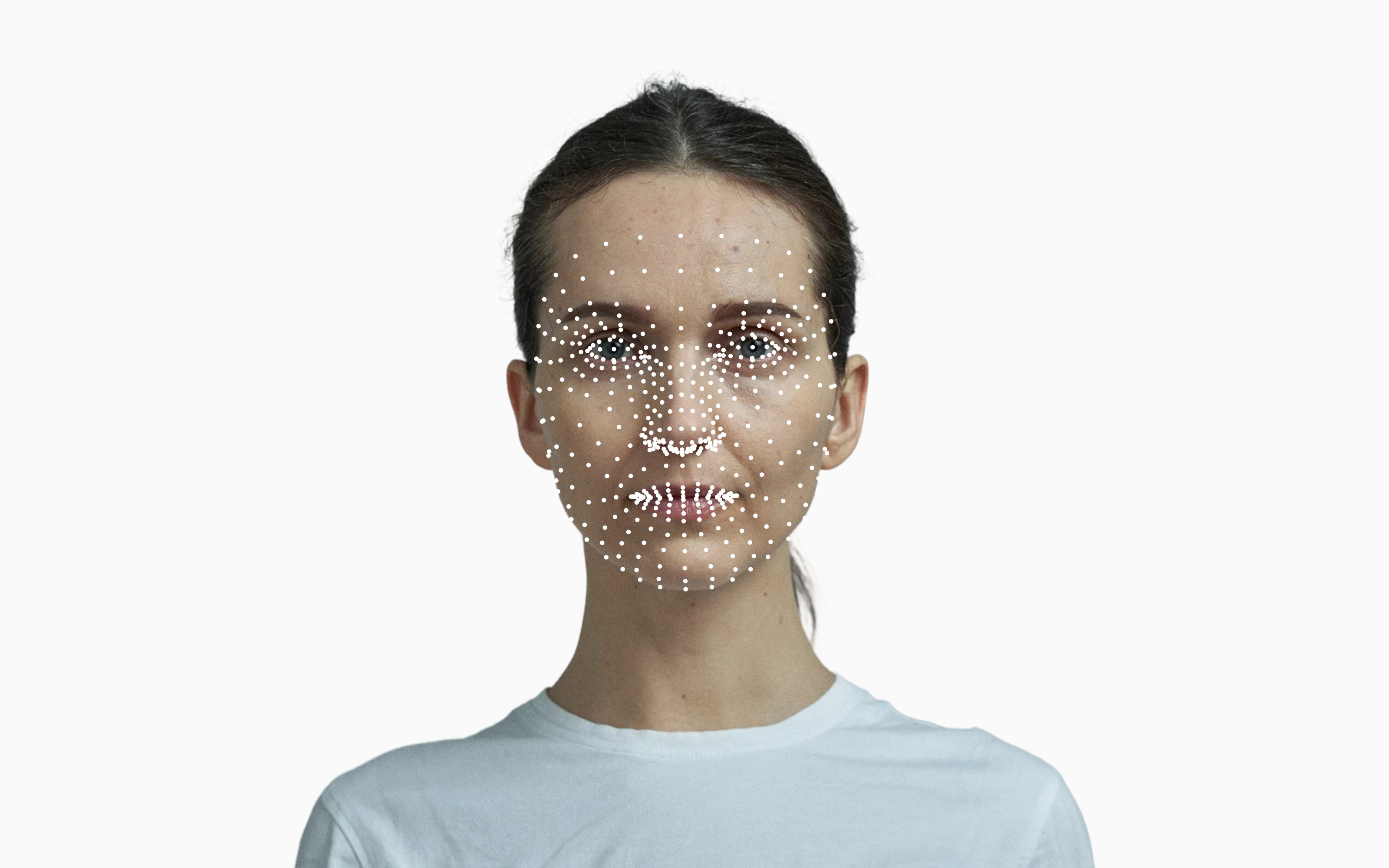 Frontal portrait of a woman with landmark points marked across her face.